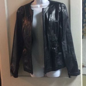 Vintage Unique Leather, w/ brass detailing.